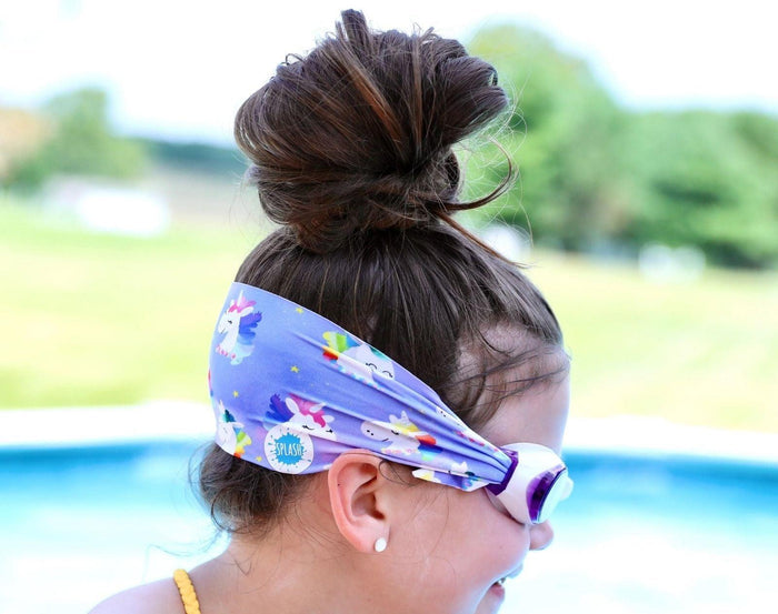 Child wearing Splash Place Unicorn Tangle-Free Swim Goggles. Available from www.tenlittle.com