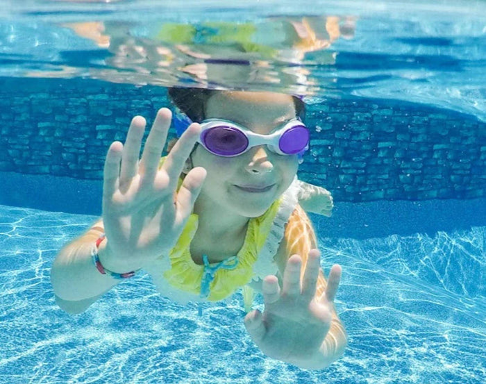 Child swimming with Splash Place Unicorn Tangle-Free Swim Goggles. Available from www.tenlittle.com