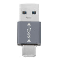 The Lucyd USB-C to USB Adapter | For Reebok is a compact, dual-ended adapter with a gray center featuring white USB and SS logos plus arrow symbols—USB-A connector on top, USB-C on bottom—perfect for quick charging.