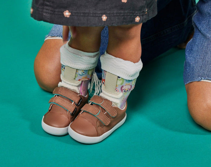 Girl wearing ten little mocha brown everyday shoe with Ten little everyday shoe mocha brown with Ten Little Velcro Strap Extenders Mocha Brown - Available at www.tenlittle.com