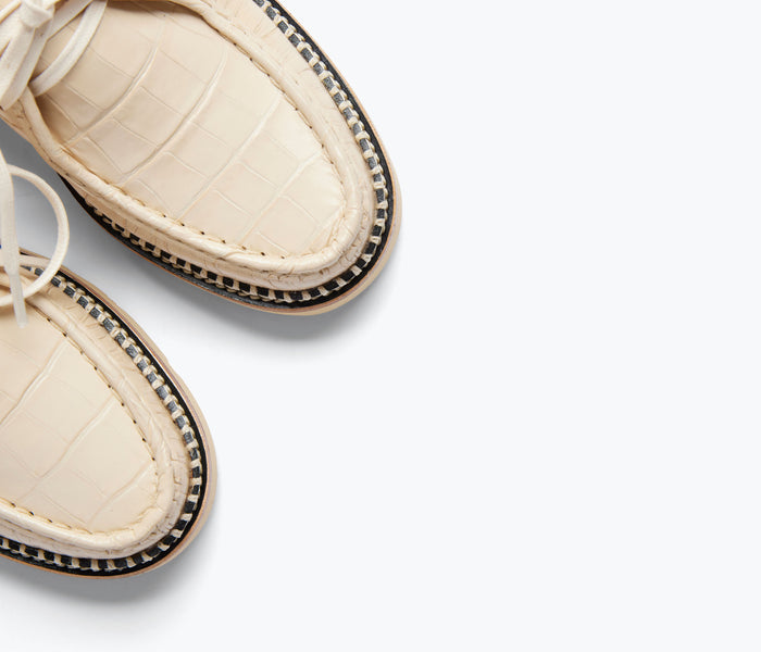 Freda Salvador Willow Lug Moccasin loafer with embossed croc detail in sand color, featuring a stylish and comfortable slip-on design.