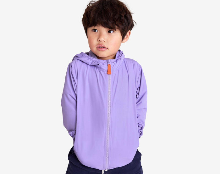 Boy wearing Primary - Windbreaker - Iris - Available at www.tenlittle.com