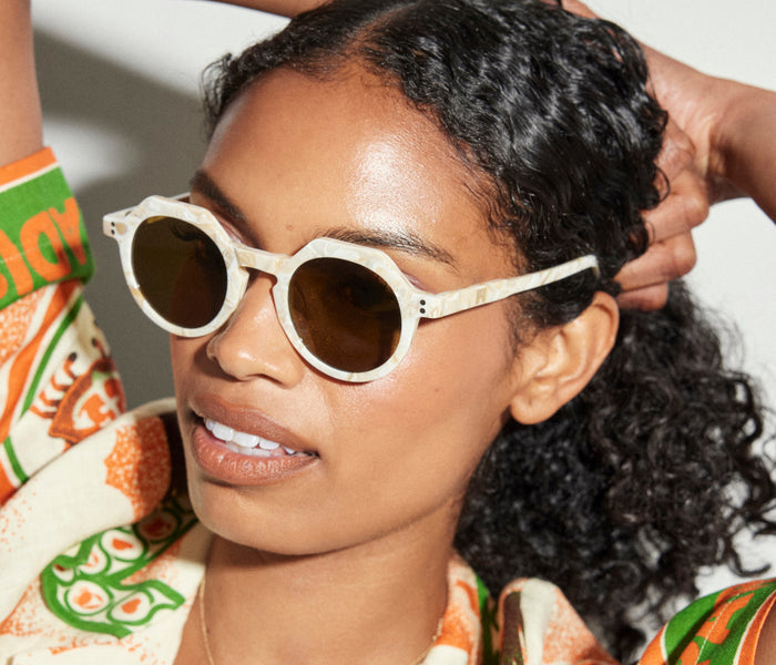 Wolfspout Georgie sunglasses with round frames and tinted lenses, stylish accessories from Wolfspout's WOLFSPOUT x FRĒDA collection.