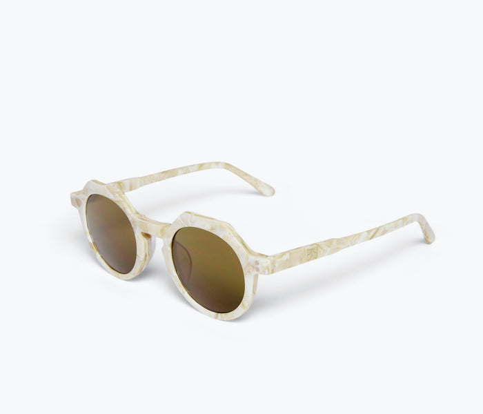 Wolfspout WOLFSPOUT x FRĒDA Georgie sunglasses with amaro olive twist frames, angled view showcasing stylish accessory design.