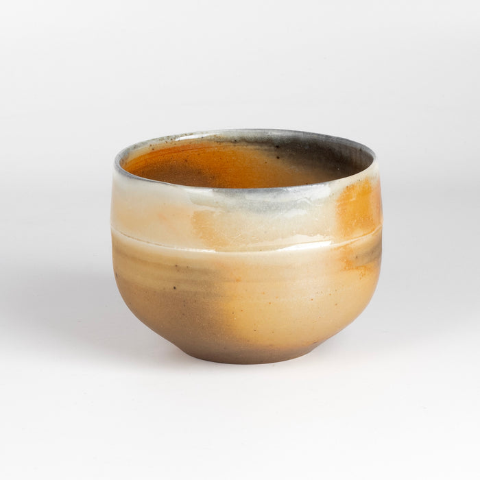 Wood Fired Tea Bowl #5 by Lilith Rockett is a one of a kind wood fired and reduction cooled matcha tea bowl in peach, brown and gray. It is hand thrown in porcelain.