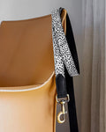 Angled shot of pony hair leash and tan leather dog collar, emphasizing premium materials and ergonomic design for comfortable walks