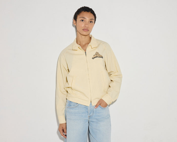 Yellow zip-up jacket from TROVE Vintage, casual apparel with a front zipper and sporty style.