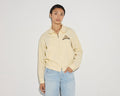 Yellow zip-up jacket from TROVE Vintage, casual apparel with a front zipper and sporty style.